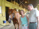 Avram C. Freedberg, his wife, Rhoda, and Ahvee’s Destiny heading back to the stable in the shed row.