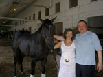Avram C. Freedberg with his wife Rhoda, and Officer Sheila T-Rex at the Saratoga Races, August 2007. 