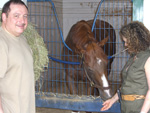 Rhoda Freedberg gives Ahvee's Destiny a carrot, while Avram looks on, June 2008.
