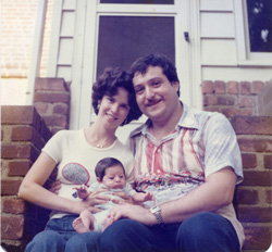 Avram, Rhoda and newborn, Jonathan, in back of their first home in